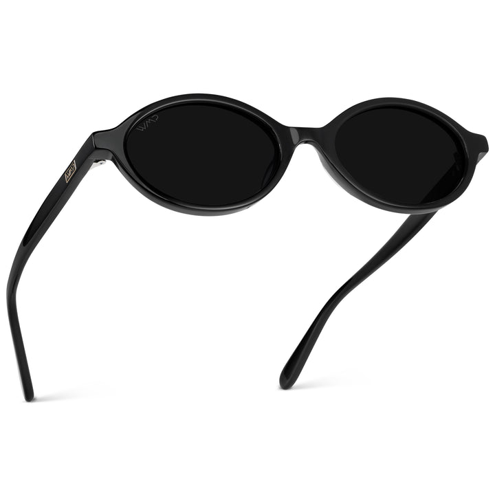WMP Eyewear – Women’s Trendy Oval Sunglasses: Small Retro Frame, 90s Y2K Style, Perfect for Everyday Wear (Black/Triple Black Lens)
